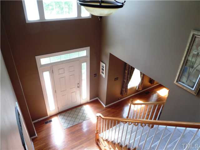 4441 Fairview Ridge Lane Apex, NC 27539 - Photo 2 of 25 Enter with a two story foyer with palladium window with lots of streaming sunlight-Hardwoods in foyer and formals.on first floor Foyer