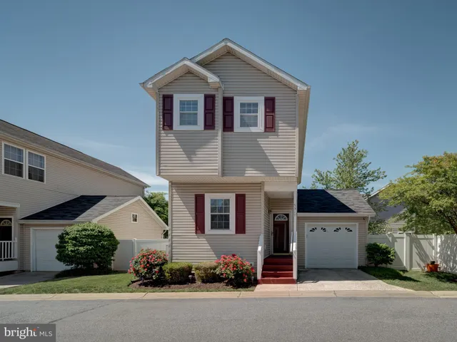 a front view of a house with a garage