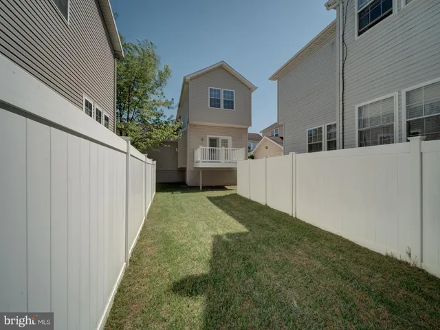 a front view of a building with trees