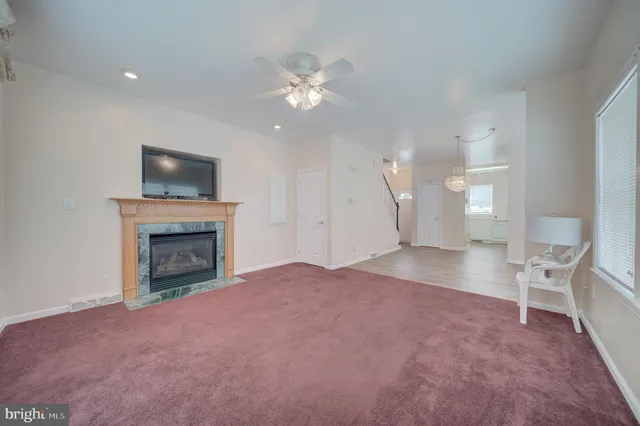 a view of a livingroom with a fireplace and a flat screen tv