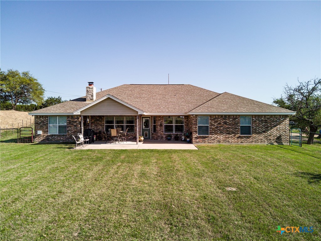 690 A County Road 4707 Kempner, TX 76539 - Photo 24 of 39 a front view of a house with swimming pool having outdoor seating