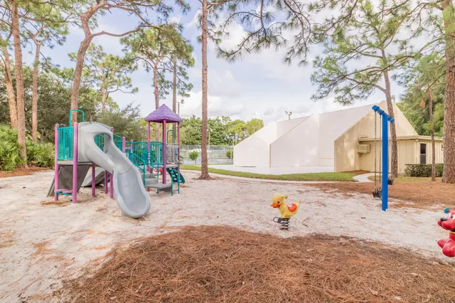 a view of outdoor space with table and chairs