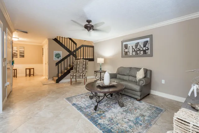 a living room with furniture and a rug
