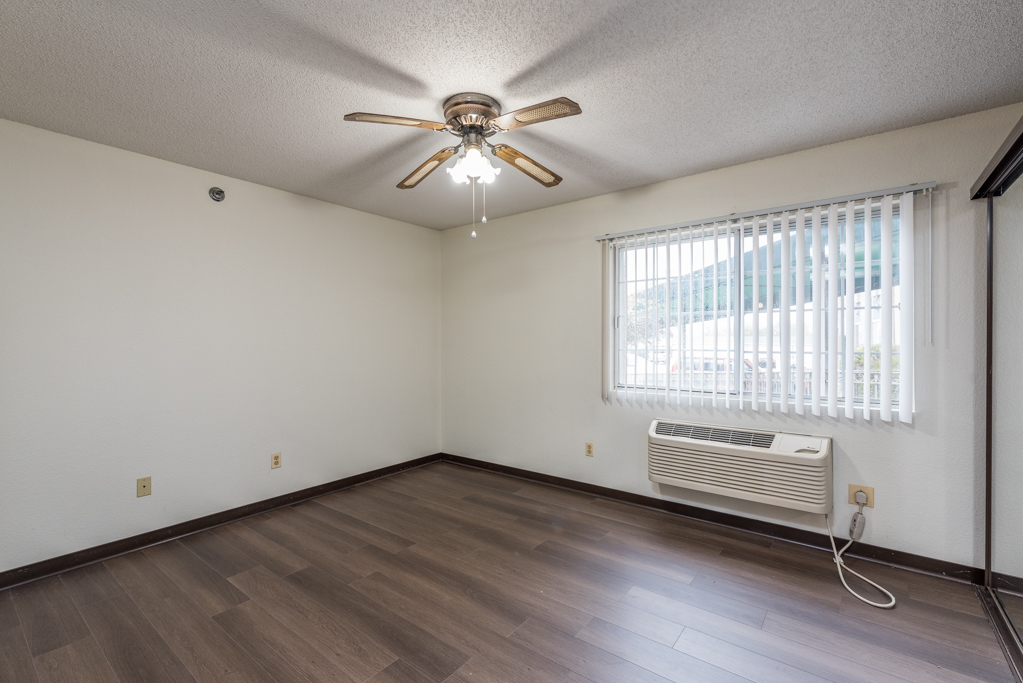 3305 Sunset Avenue, Unit 217 Waukegan, IL 60087 - Photo 8 of 17 wooden floor in an empty room with a window