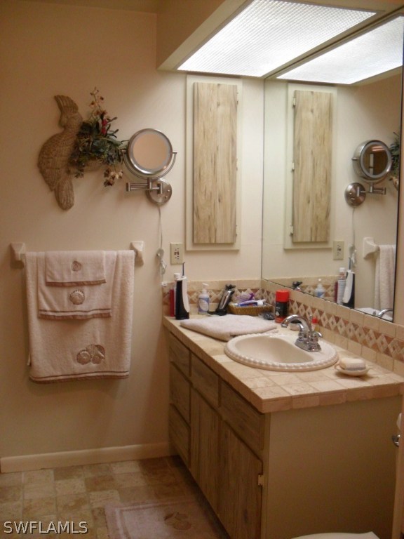 2561 Zeligro Road Alva, FL 33920 - Photo 8 of 18 a bathroom with a sink and a mirror