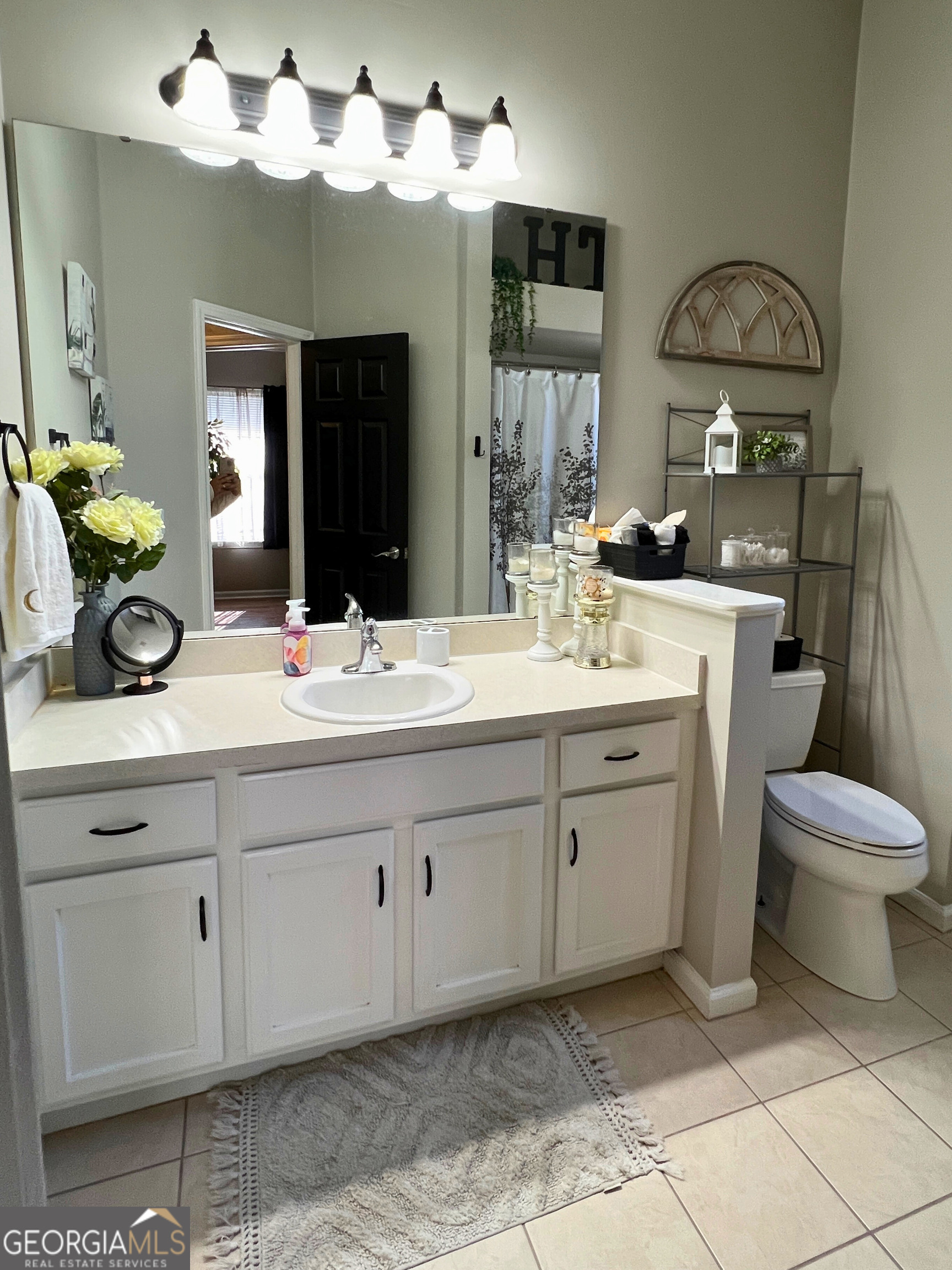 202 Bent Tree Court St. Marys, GA 31558 - Photo 19 of 25 a bathroom with a double vanity sink and a mirror