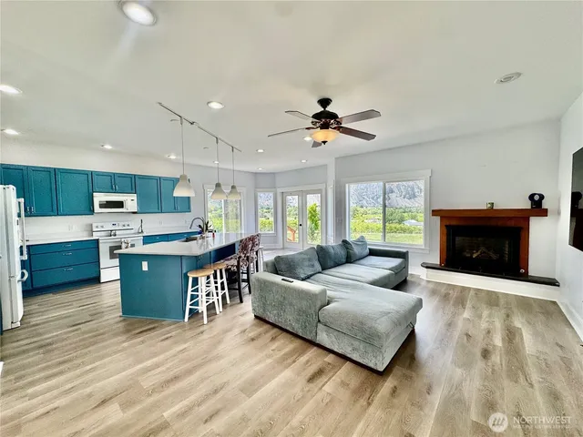 a living room with furniture and a fireplace