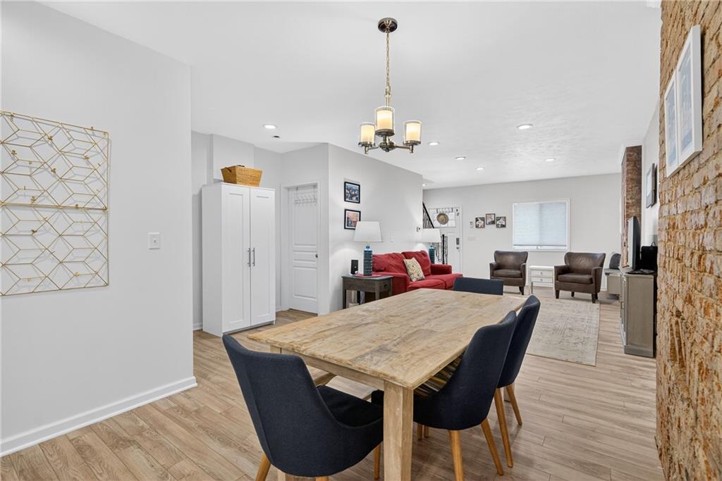 4536 Friendship Avenue Pittsburgh, PA 15224 - Photo 11 of 38 a view of a dining room with furniture and wooden floor