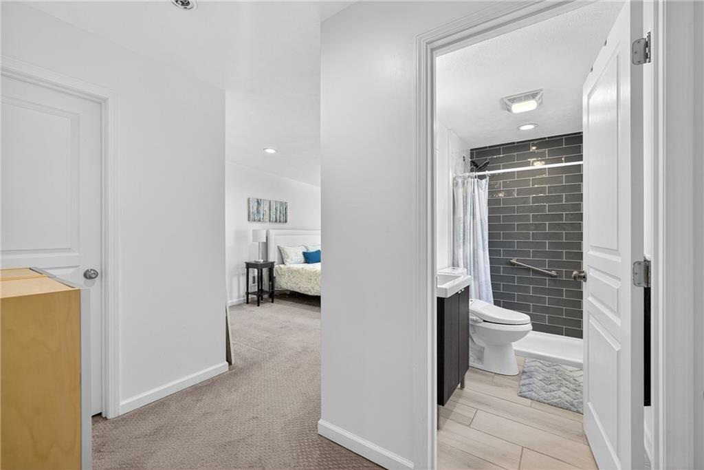 4536 Friendship Avenue Pittsburgh, PA 15224 - Photo 20 of 38 a bathroom with a toilet sink and shower