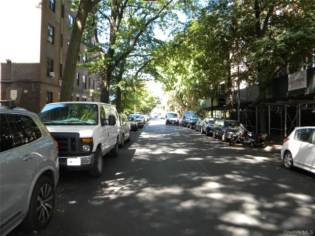 a view of a street with cars