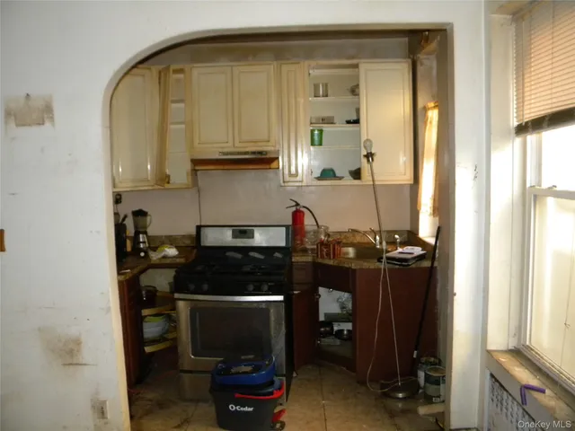 a kitchen with a sink and cabinets