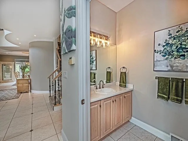 a bathroom with a sink a mirror and a toilet