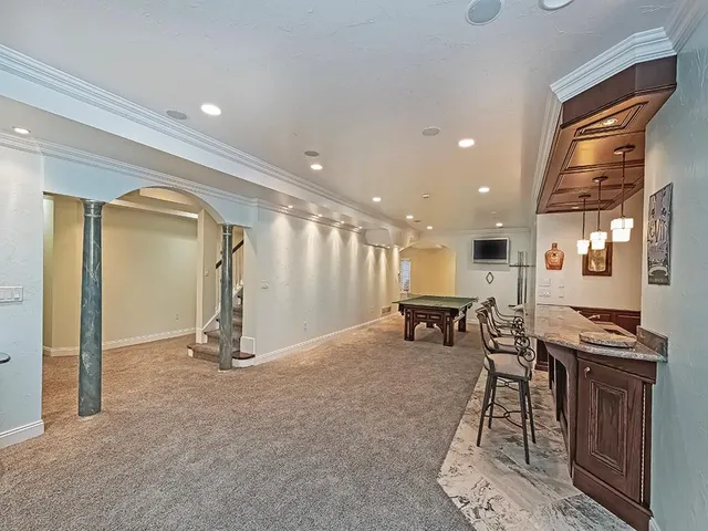 a view of kitchen with furniture and refrigerator