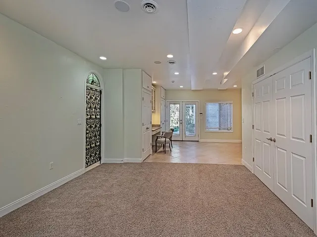 a view of an empty room with a cabinet