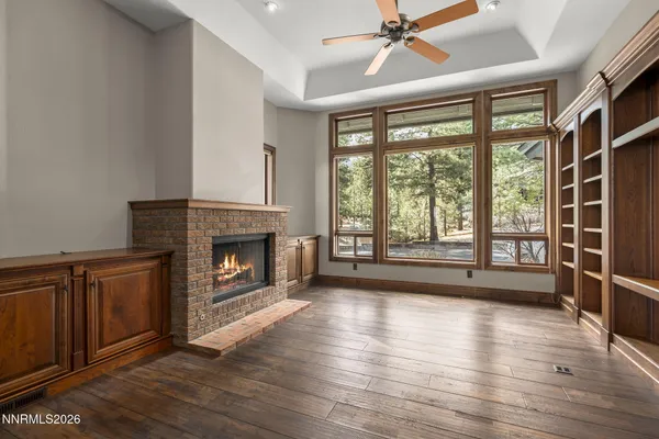 a kitchen with stainless steel appliances kitchen island granite countertop a refrigerator and cabinets