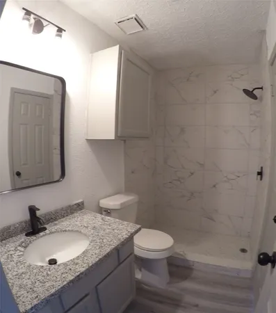 a view of wooden floor and windows in a room