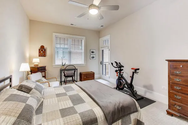 a spacious bedroom with a bed and a couch