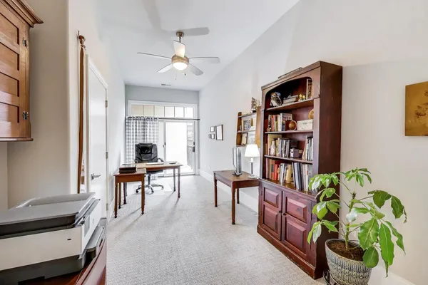 a workspace with furniture and chandelier