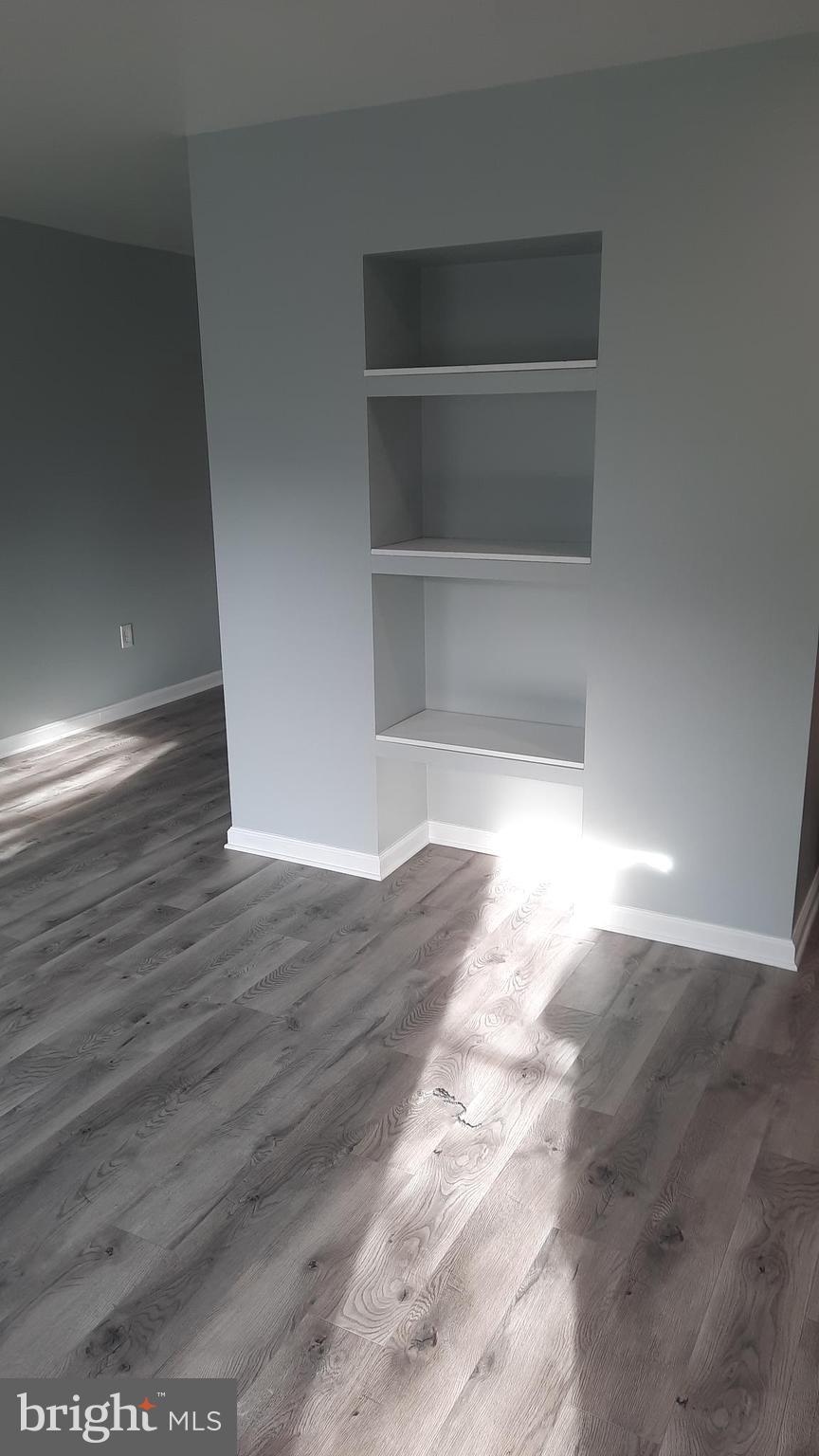618 Colonial View Road Mechanicsburg, PA 17055 - Photo 12 of 23 a view of empty room with wooden floor and fan