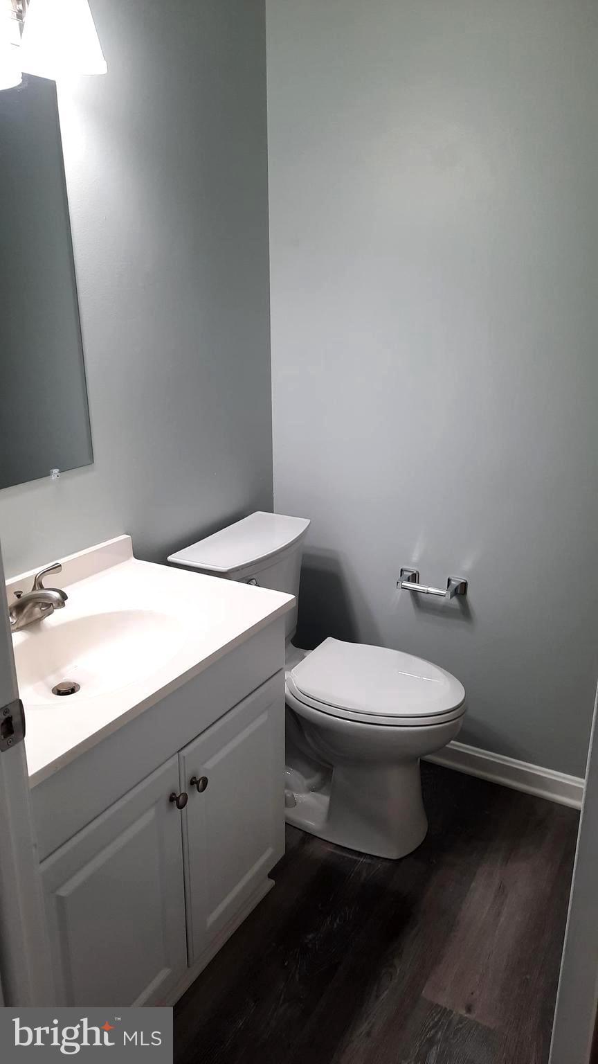618 Colonial View Road Mechanicsburg, PA 17055 - Photo 13 of 23 a bathroom with a toilet sink and mirror