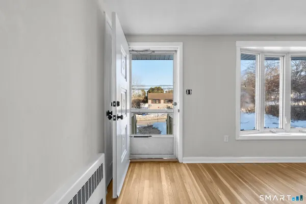 a view of a hallway with a living room