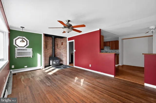 a view of a livingroom with wooden floor