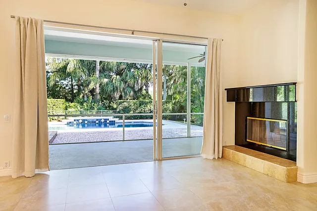 a view of kitchen and kitchen with stainless steel appliances granite countertop cabinets