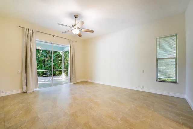 a spacious bathroom with a granite countertop tub shower and sink