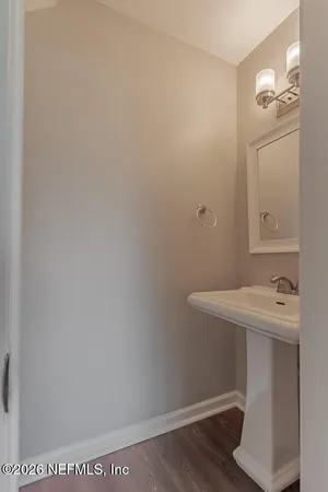 a bathroom with a sink and vanity