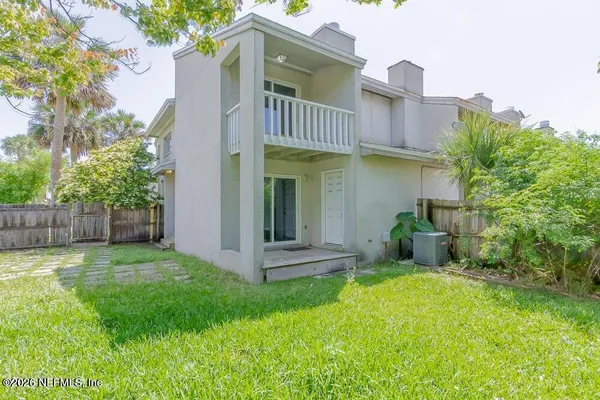 a view of a house with a yard and plants