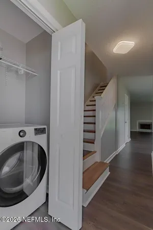 a view of a kitchen from a hallway