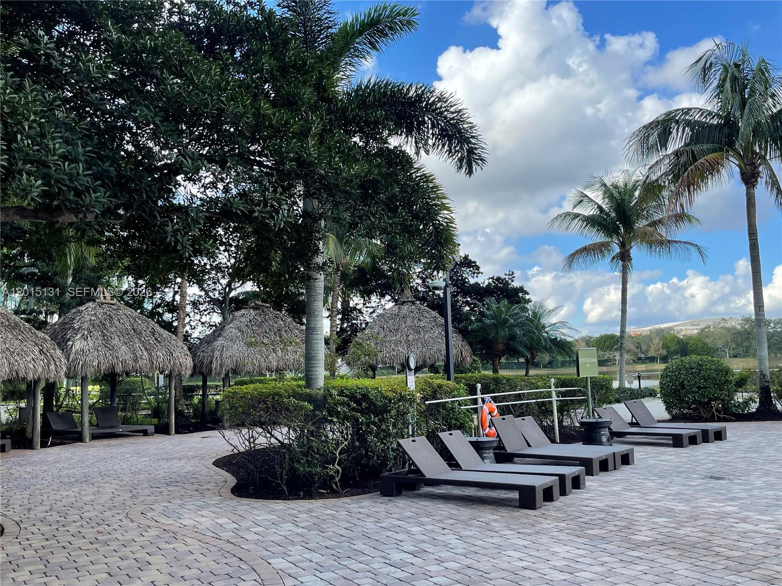2681 North Flamingo Road, Unit 2004S Sunrise, FL 33323 - Photo 19 of 26 a view of a patio with swimming pool and furniture