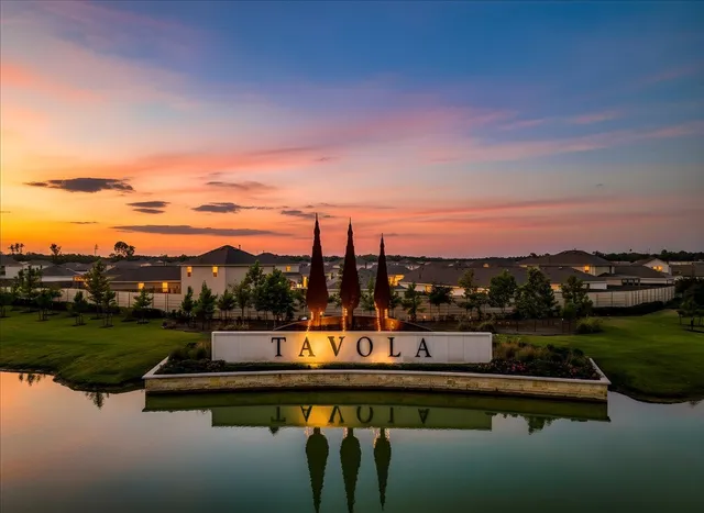 an aerial view of residential houses with outdoor space and river