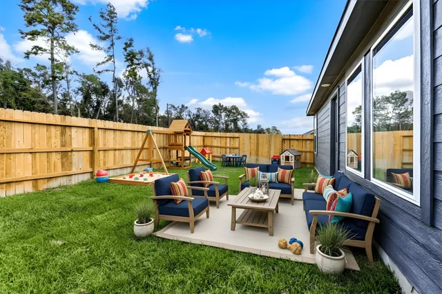 a view of back yard with outdoor seating