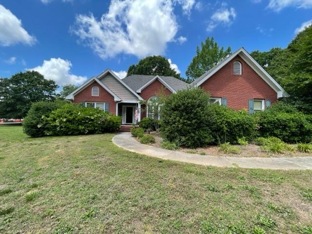 635 Rock Springs Road Grayson, GA 30017 - Photo 1 of 1 a view of a house with a yard and potted plants