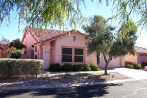 3565 West Sky Ridge Loop Tucson, AZ 85742 - Photo 1 of 3 a front view of a house with a yard and garage