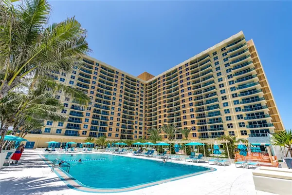 a view of a chairs and table in a backyard