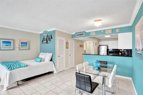 a bedroom with a bed and a table in it