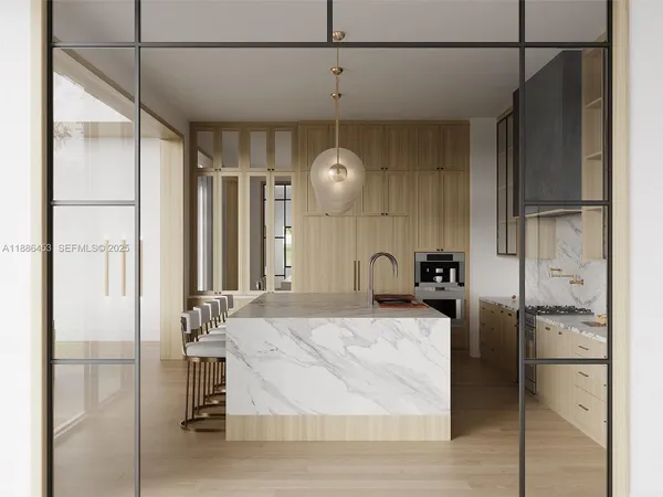 a kitchen with stainless steel appliances kitchen island granite countertop a refrigerator and microwave