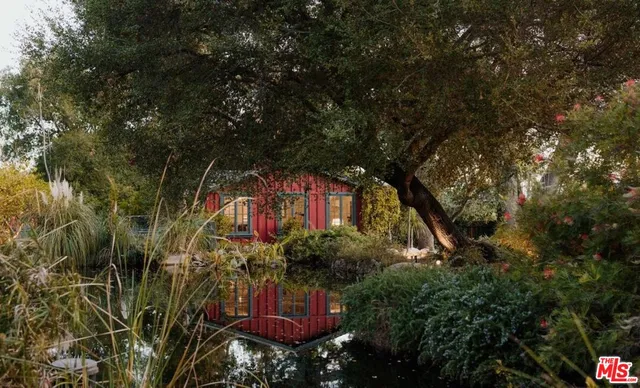 a view of a patio with table and chairs and potted plants