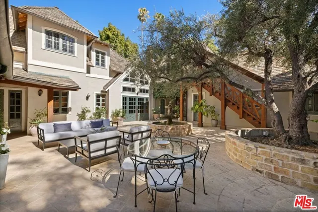 a spacious bedroom with a large bed and a fireplace