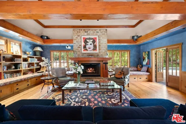 a bathroom with a sink a mirror a window and a bathtub