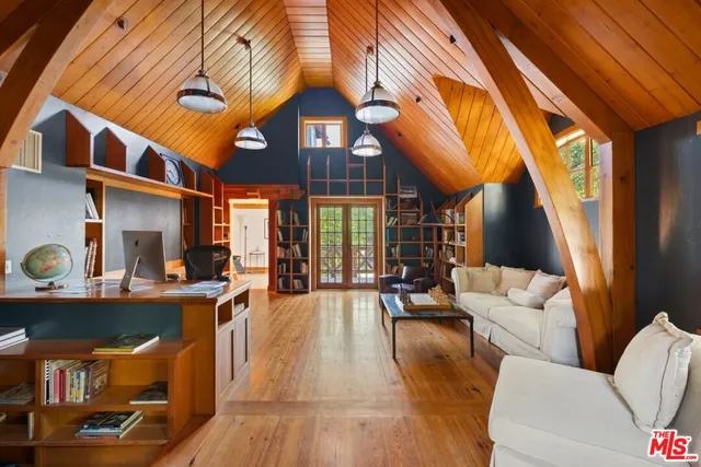 a bathroom with a granite countertop sink mirror vanity and a bathtub