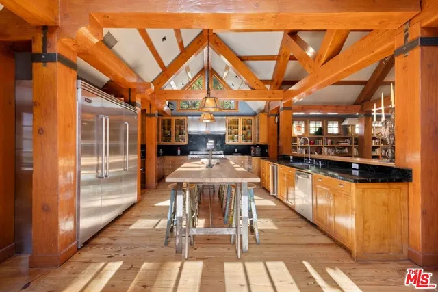 a bedroom with a bed and a table