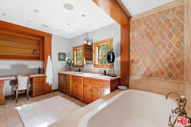 a view of a patio with table and chairs