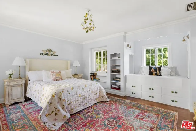 a bed room with a bed and a window