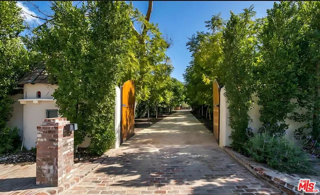 a house with swimming pool in front of it