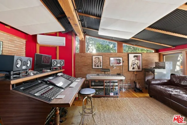 a bedroom with bed and a window