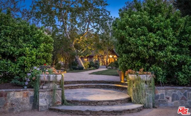 an aerial view of residential houses with outdoor space and street view