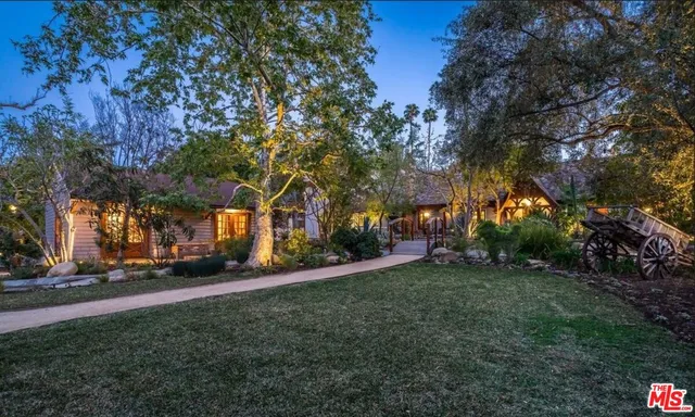 a view of swimming pool with outdoor seating and plants